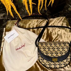 Brand new cross body purse from Farragamo .. beautiful elegant pattern !